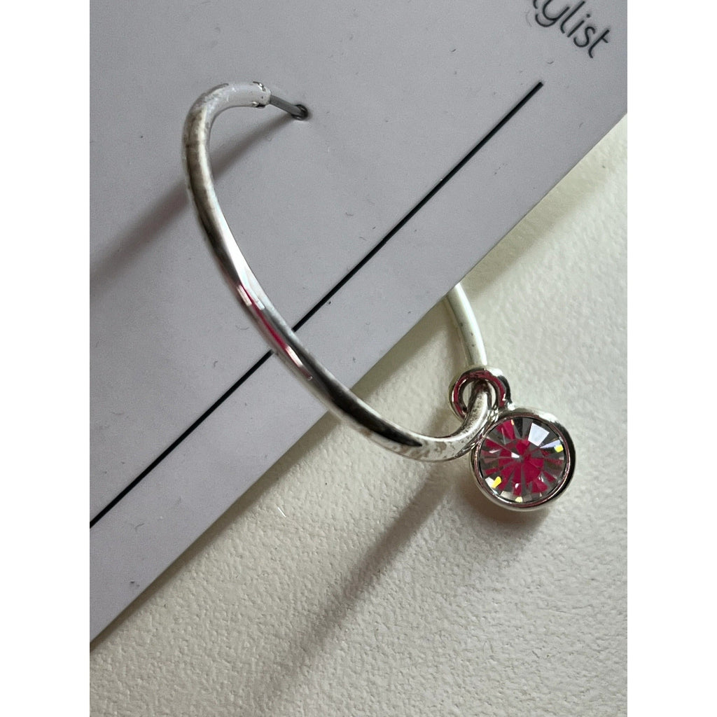 Silver metal hoop earrings with crystal charm