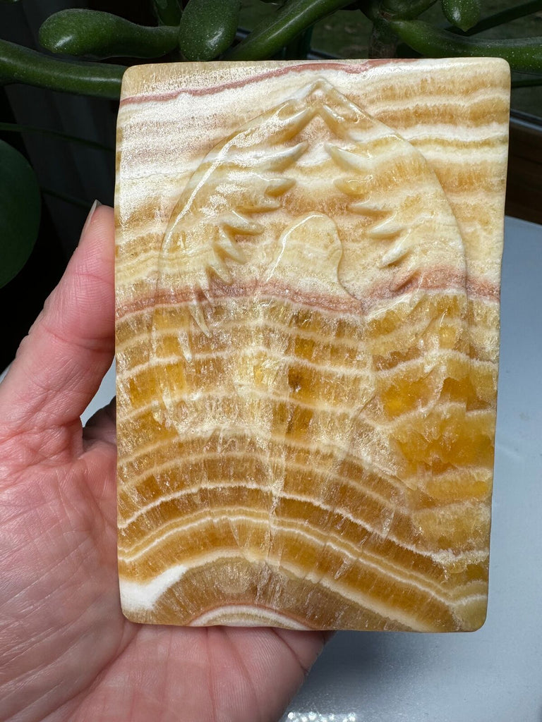 Angel wing carved calcite slab